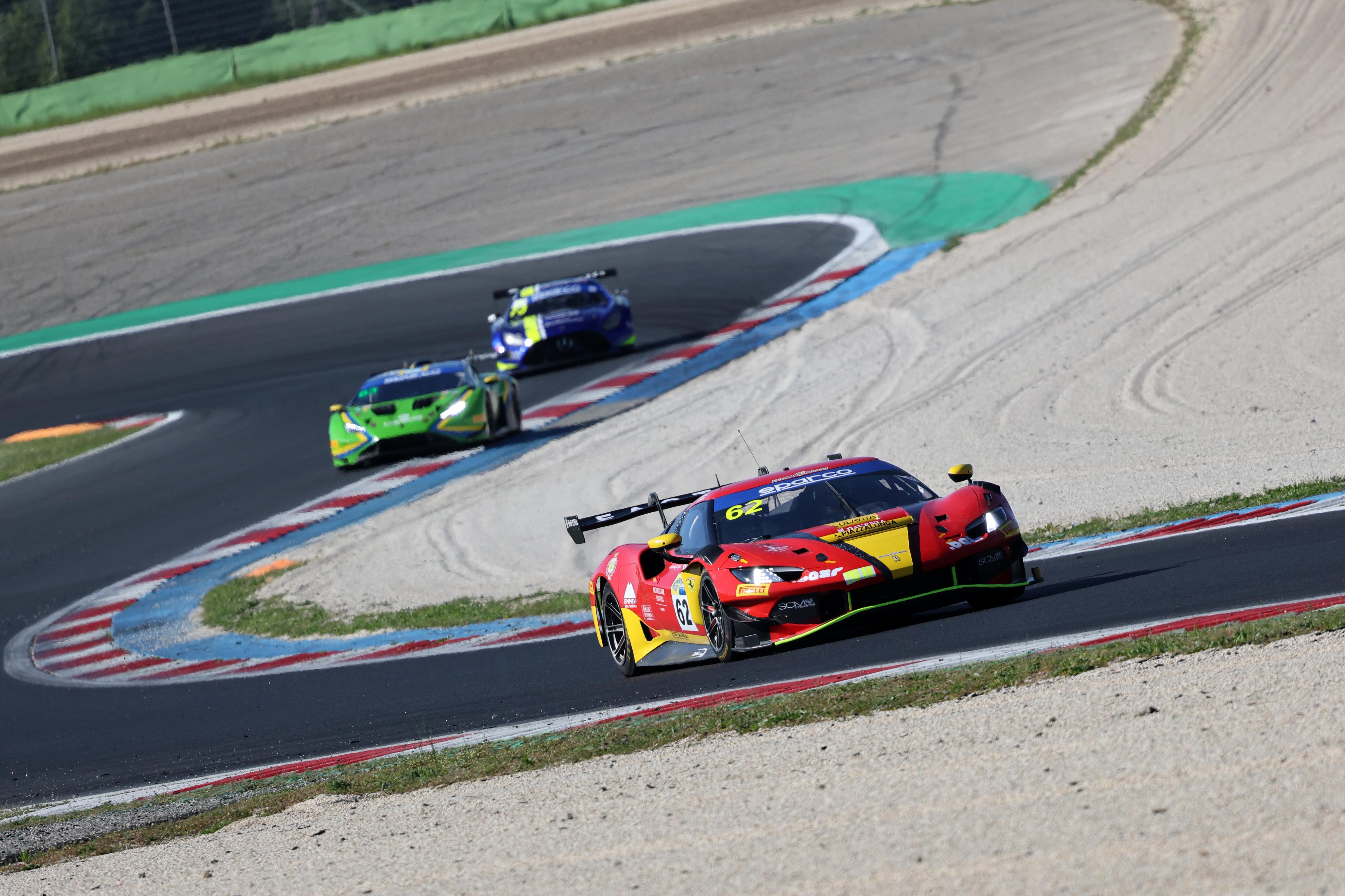 A pack of GT cars through a sequence of corners